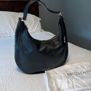 Michael Kors large black pebbled leather shoulder bag with dust cover.